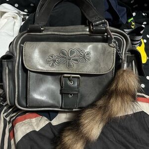 The Stone Floral Dusk Black and Gray Shoulder Bag with Raccoon Tail